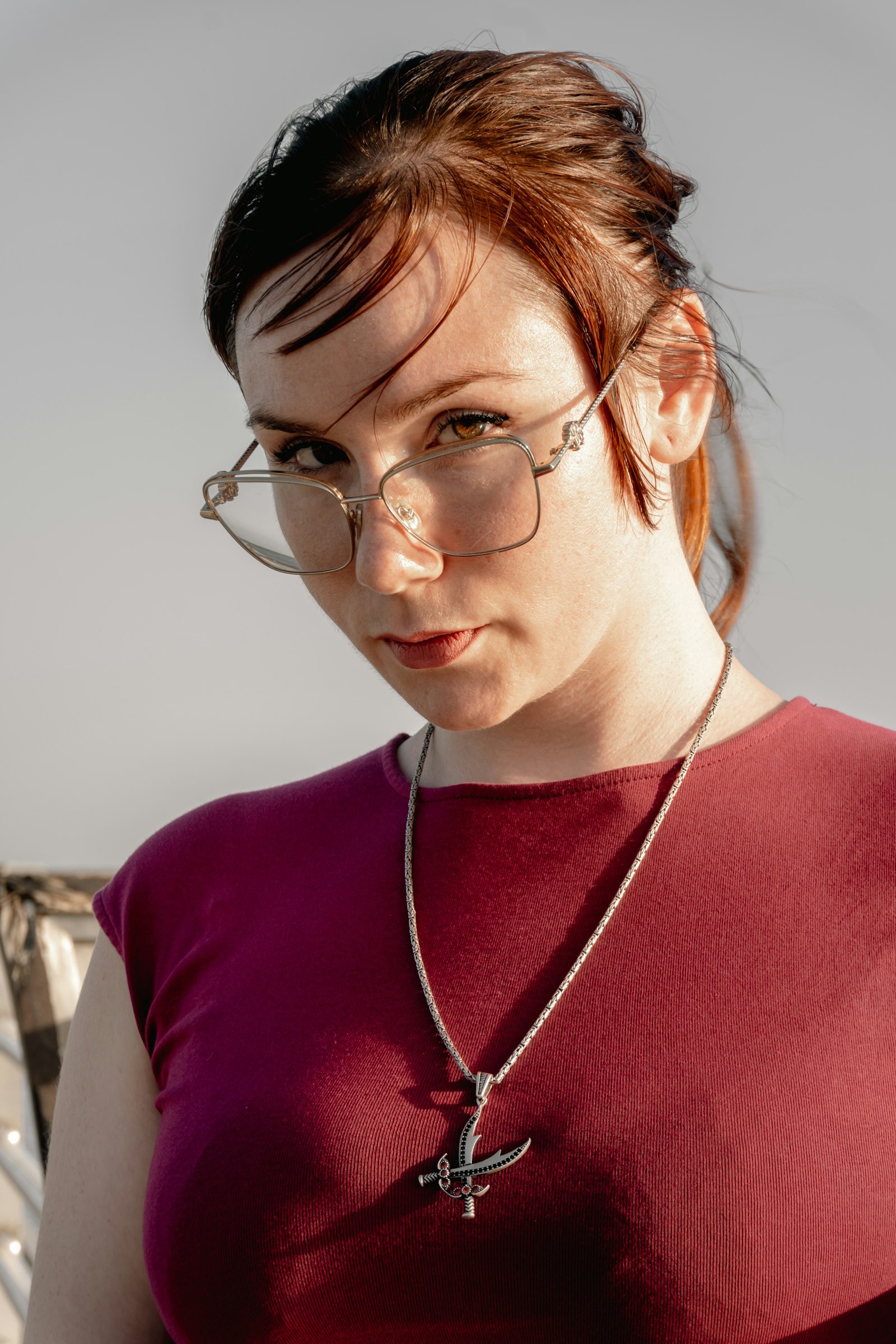 Portrait of a woman wearing a fine pendant